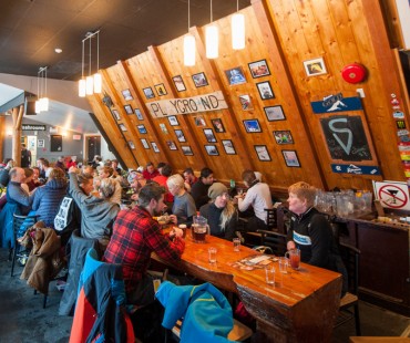 People enjoying apres ski at popular Griz Bar