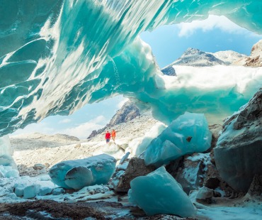 Frozen Glacier with people viewing in the background