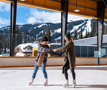 People skating on the ice rink in Sun Peaks