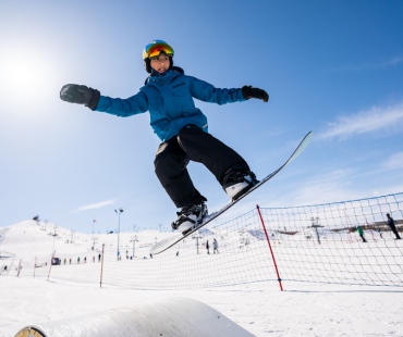 Snowboarder jumping at WinSport Calgary