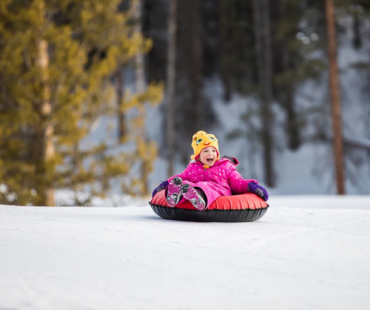 Child enjoying Tubing at Aspen