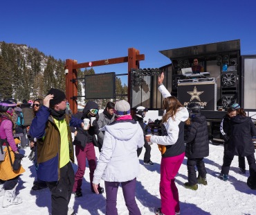 People dancing to the DJ on the mountain