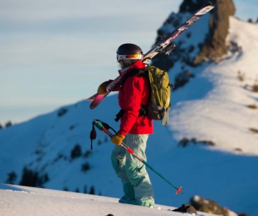 Stunning views and skier hiking the mountain backcountry