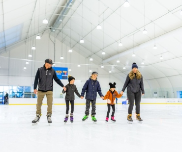 Family ice skating in mammoth