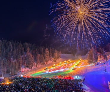 Fireworks and torch lit lights along the slopes