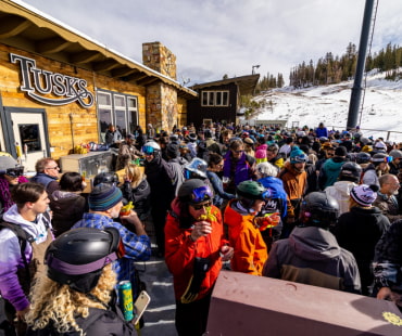 Many people enjoying some beverages and apres ski at famous Tusks