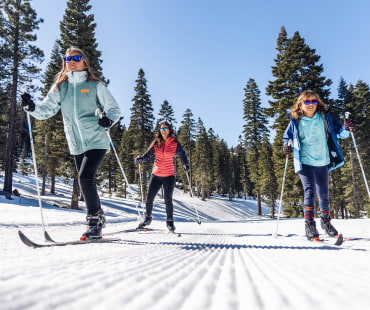 3 people on the nordic trails cross country skiing