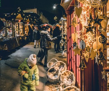 People browsing at the lit up christmas markets