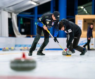 People curling on the ice