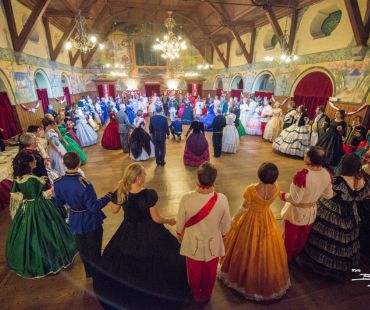 People in traditional clothing enjoying song and dance