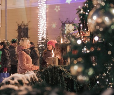 People enjoying lit up christmas activities