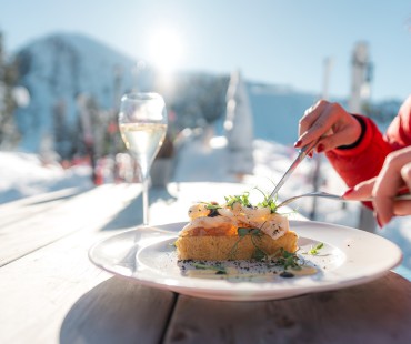 Nicely plated meal and wine with alpine views