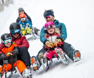 Family enjoying the fun sledding trails