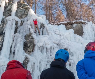 People climbing the frozen waterfalls at Maurienne