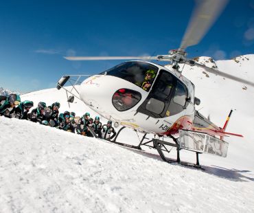 Helicopter and tour goers on the glacier