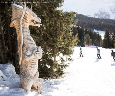 Dragon statues on snowy runs