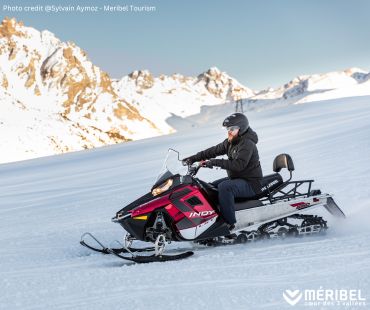 Person riding snowmobile on the trails