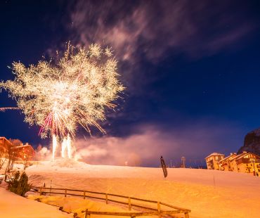 Fireworks lighting up the ski hill at night