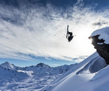 Skier flipping off cliff