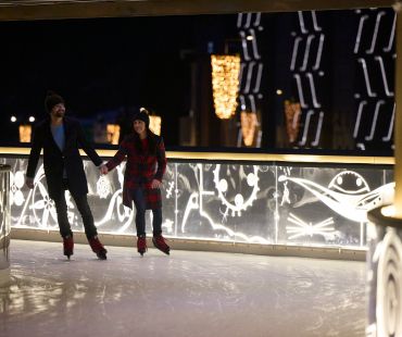 Couple ice skating on the Rink at Ischgl