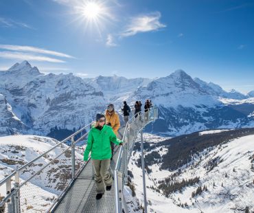 people walking on high altitude platform with views