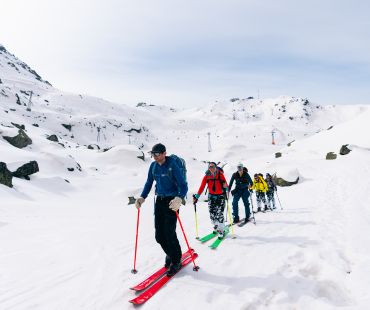 Skiers hiking through the snow