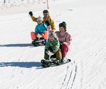 Family on Snow Racers at 8 Peaks