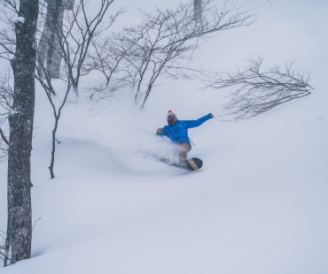 snowboarder in deep powder snowboarder in deep powder