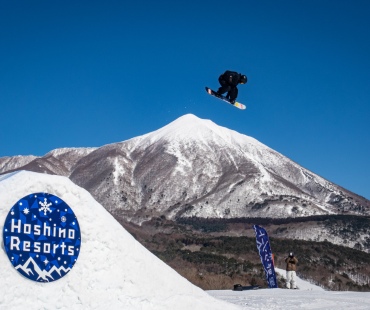 Snowboarder hitting large jump Snowboarder hitting large jump