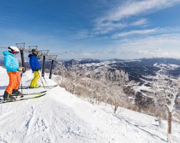 Two Skiers overlooking Tomamu ski resort