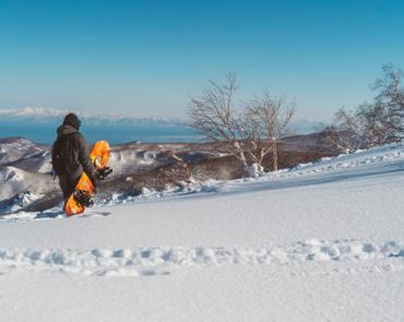 Snowboarder overlooking Resort